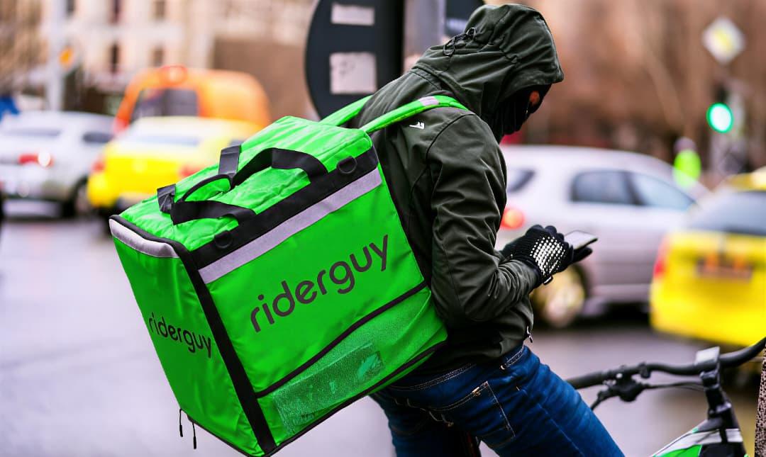 A RiderGuy rider on the road